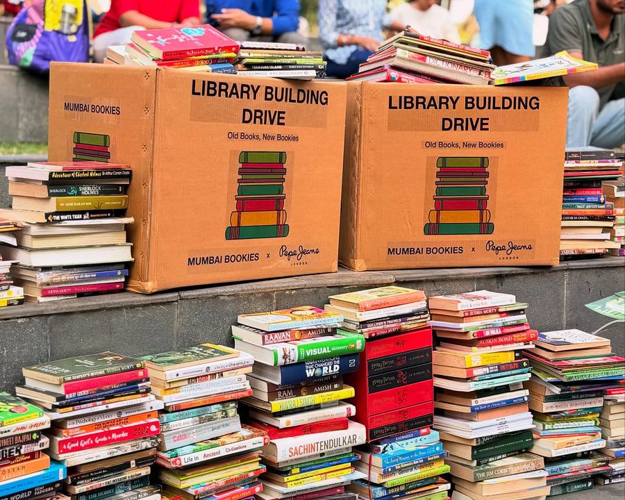 Crates of donated books sorted in the park