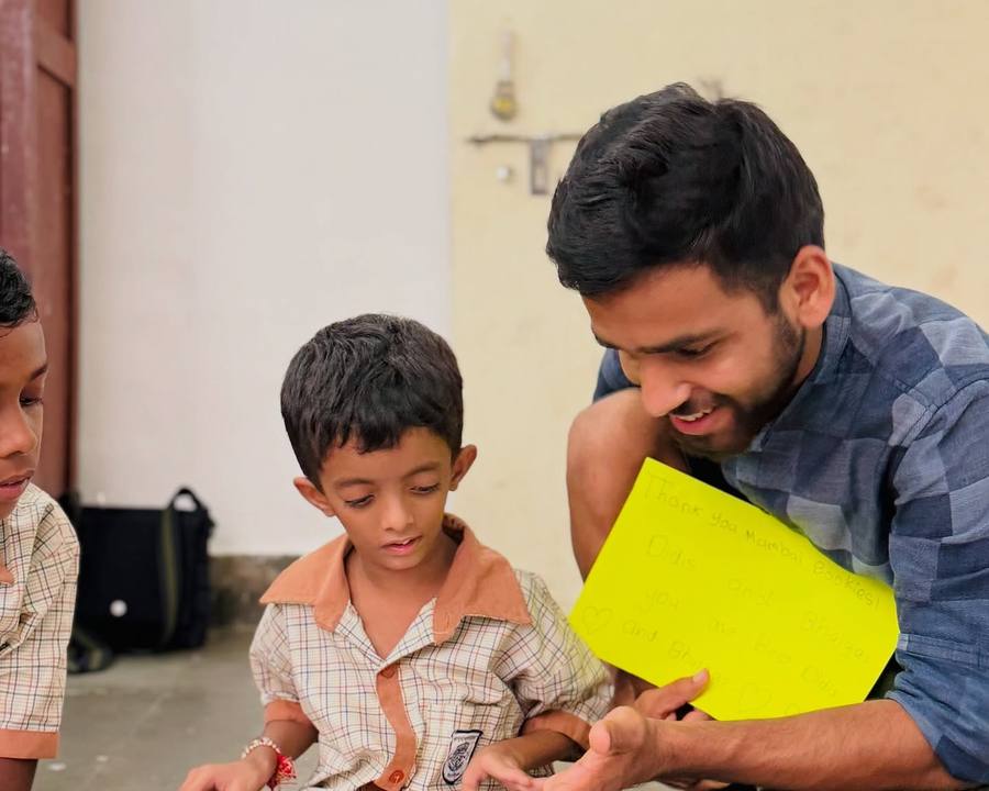 A volunteer reading with a young child