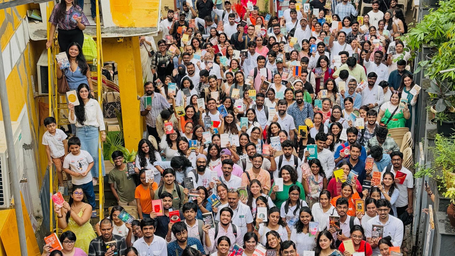 Hundreds of Mumbai Bookies readers gathered together holding books
