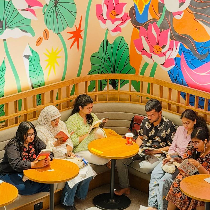 Readers in a brightly painted room