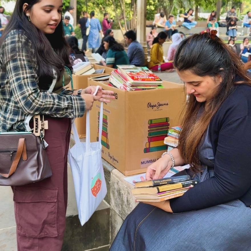 Books being handed out from crates