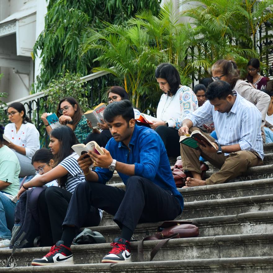 Readers on wide stone steps