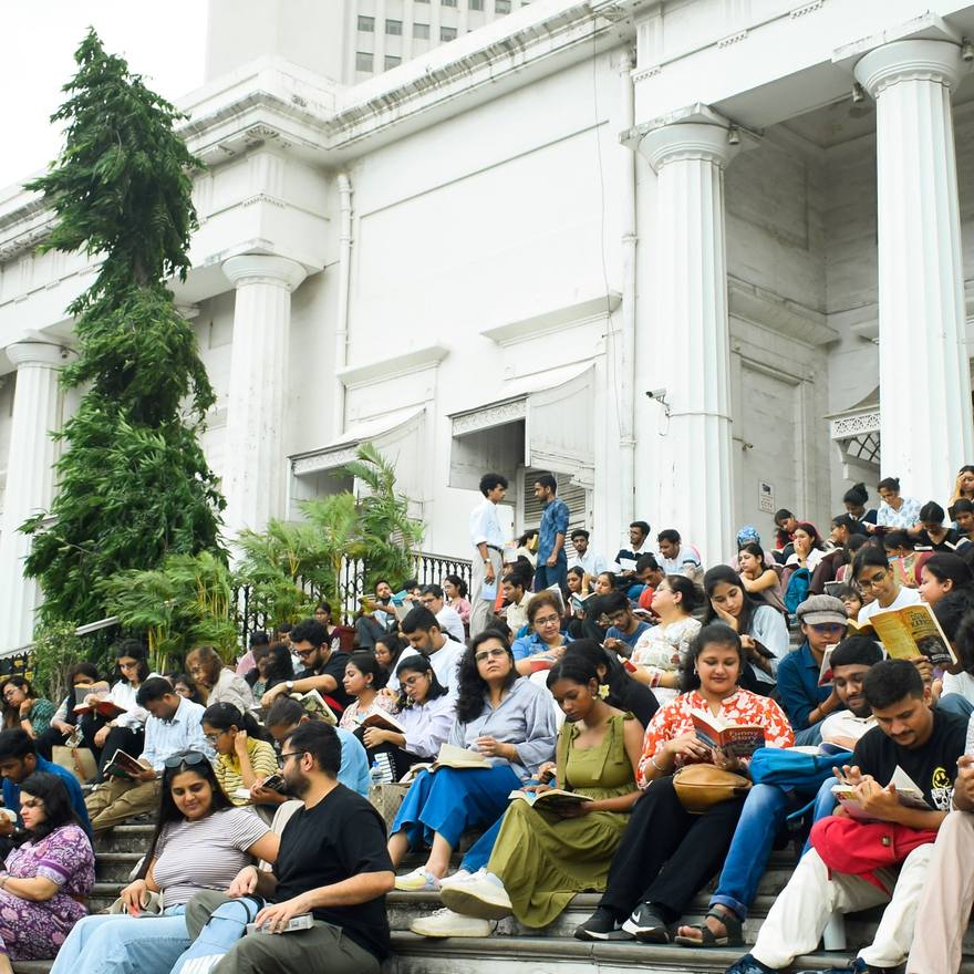 A crowd on the steps of a heritage building